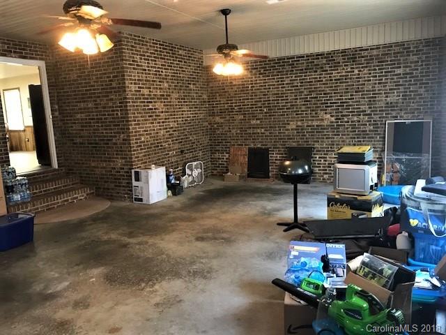 2426 New Cut Church Road Lancaster, SC 29720 - Photo 25 of 28 a living room with furniture and a fireplace
