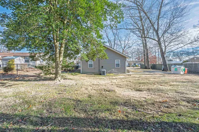 a house with trees in front of it