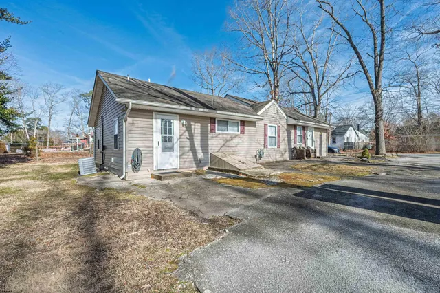 a house with trees in front of it