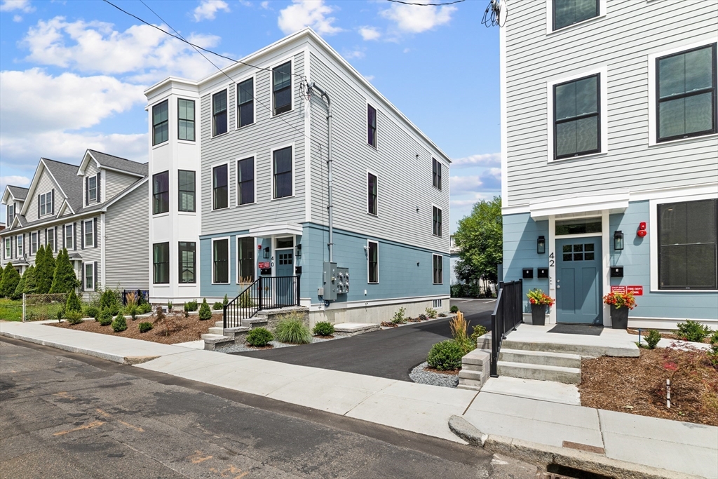 40 Waverly Street, Unit 2 Boston, MA 02135 - Photo 1 of 7 a view of a building with street view