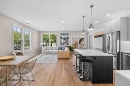42 Waverly Street, Unit M Boston, MA 02135 - Photo 7 of 24 a living room with furniture and wooden floor