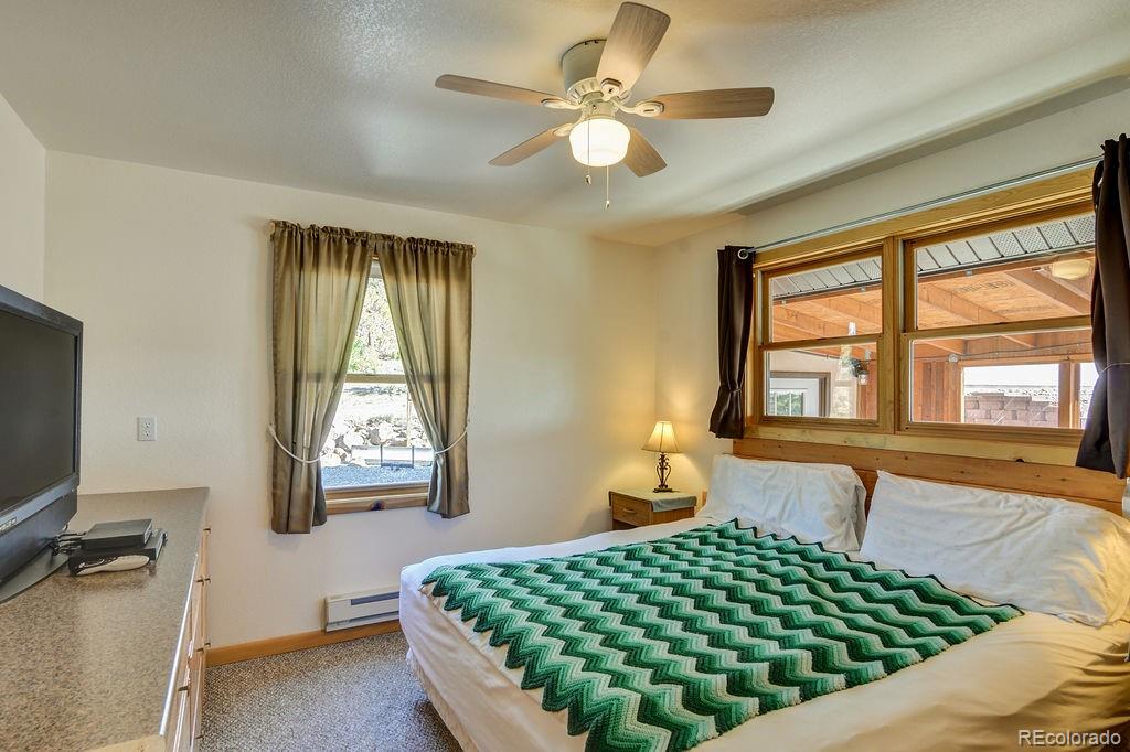 681 Forge Road Hartsel, CO 80449 - Photo 15 of 41 a bedroom with a bed and window