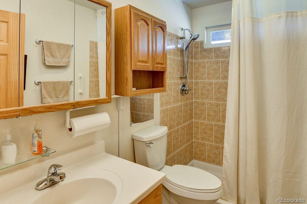 681 Forge Road Hartsel, CO 80449 - Photo 17 of 41 a bathroom with a sink toilet and shower