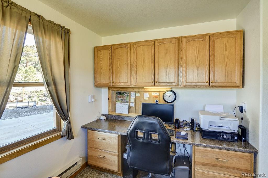 681 Forge Road Hartsel, CO 80449 - Photo 20 of 41 a living room with furniture and a window