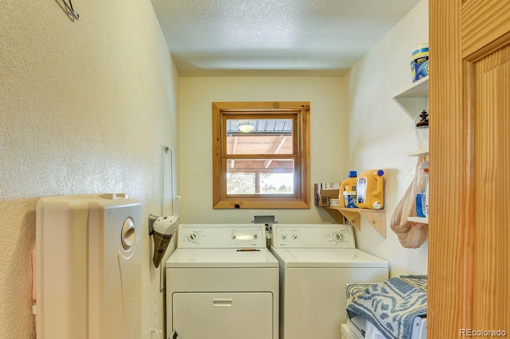 681 Forge Road Hartsel, CO 80449 - Photo 21 of 41 a view of a storage & utility room with a window