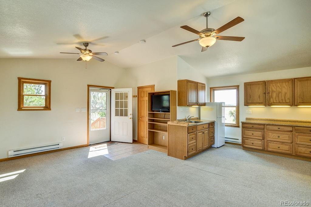 681 Forge Road Hartsel, CO 80449 - Photo 25 of 41 a view of a kitchen with microwave and a stove top oven