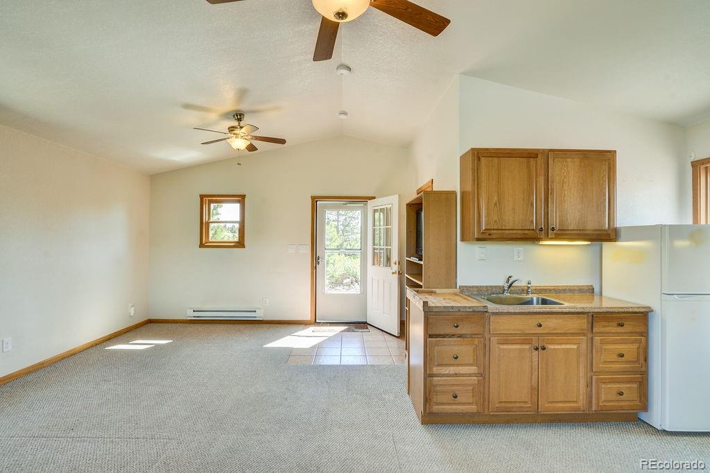 681 Forge Road Hartsel, CO 80449 - Photo 26 of 41 a view of a kitchen with furniture and ceiling fan