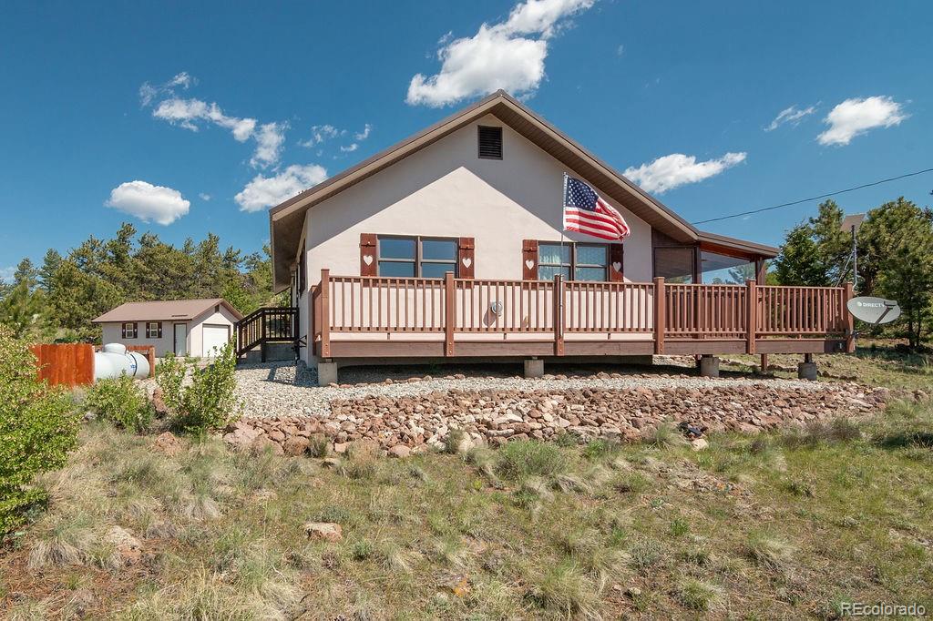 681 Forge Road Hartsel, CO 80449 - Photo 3 of 41 a view of a house with a yard