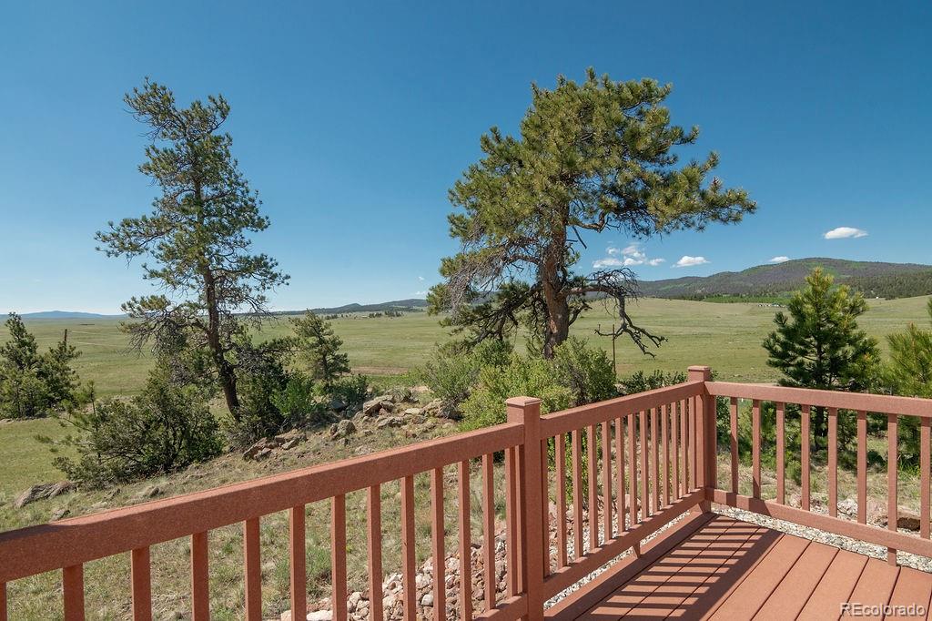 681 Forge Road Hartsel, CO 80449 - Photo 33 of 41 a view of a balcony with wooden fence