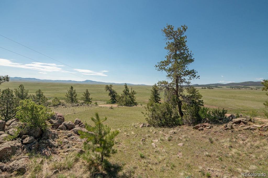 681 Forge Road Hartsel, CO 80449 - Photo 35 of 41 a view of a lake with a mountain in the background