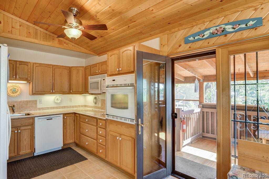 681 Forge Road Hartsel, CO 80449 - Photo 10 of 41 a kitchen with a sink window and cabinets