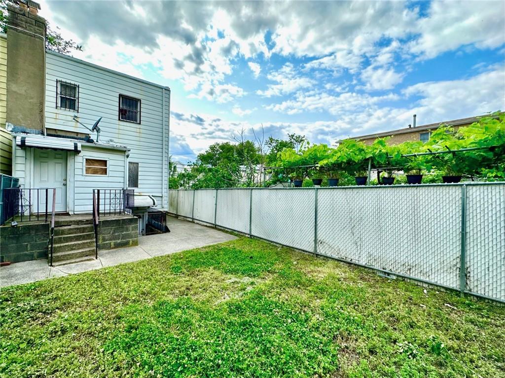 457 Van Sicklen Street Brooklyn, NY 11223 - Photo 8 of 8 a view of backyard with a garden and stairs