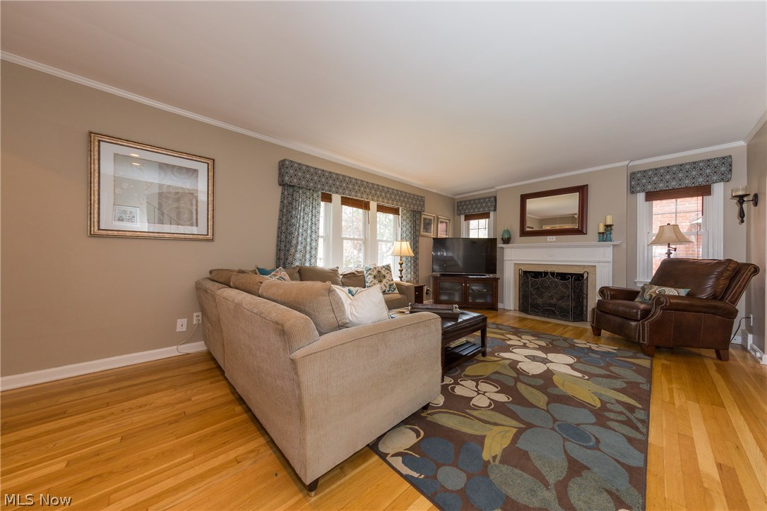 2465 Traymore Road Cleveland, OH 44118 - Photo 5 of 34 The large Living Room has a marble surround gas fireplace with mantle and windows either side