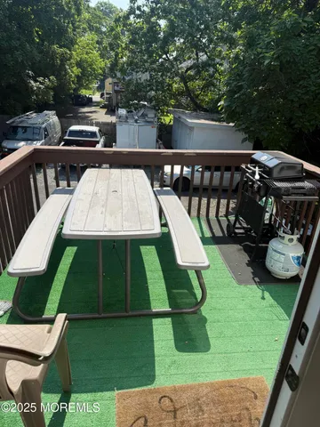 a view of a backyard with sitting area