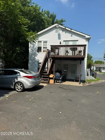 a view of a car park in front of house