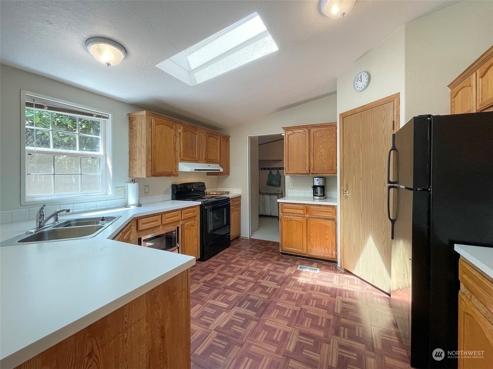 1010 Lemmon Road Port Angeles, WA 98362 - Photo 14 of 40 a kitchen with granite countertop a refrigerator stove top oven and sink