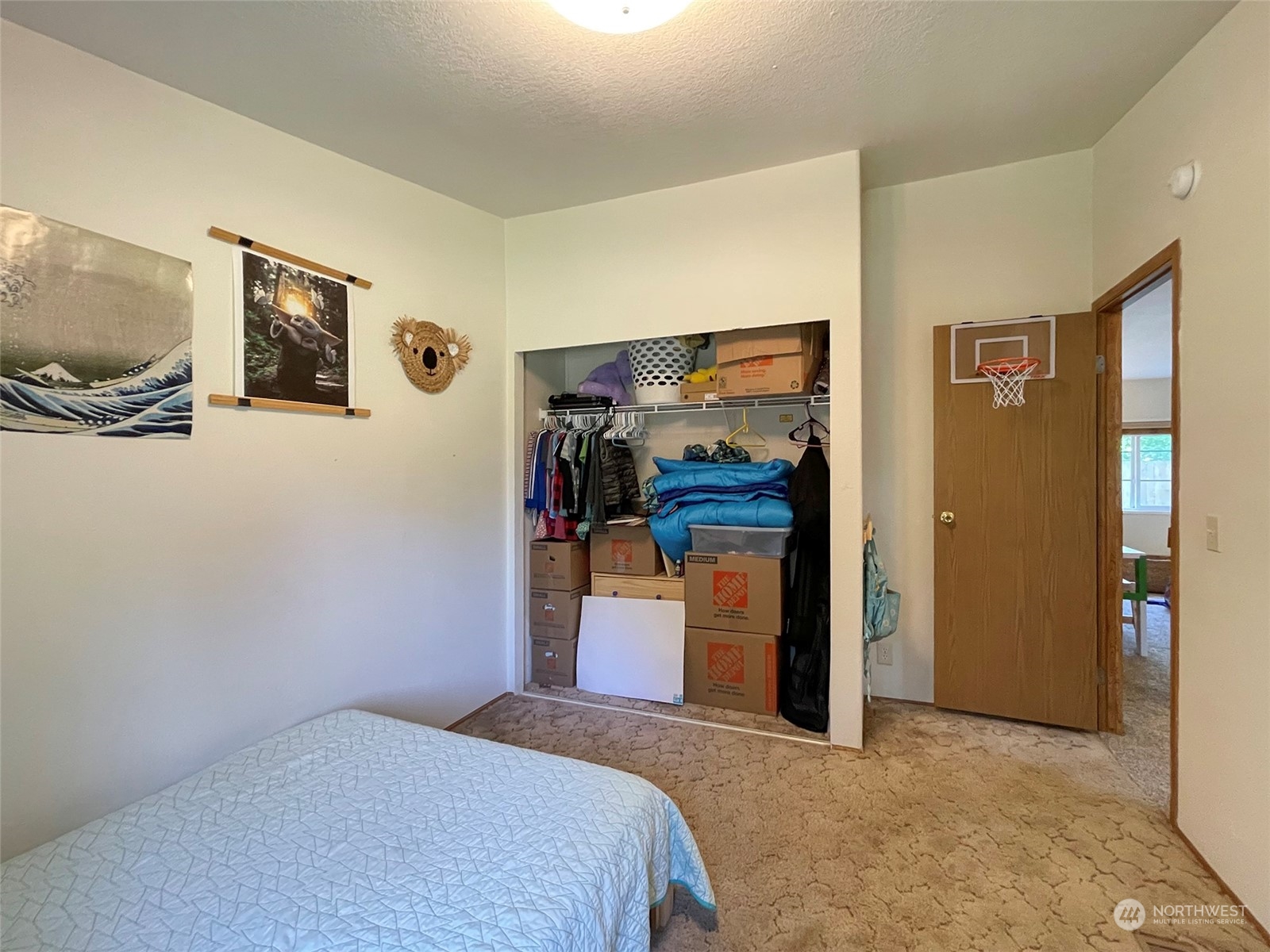 1010 Lemmon Road Port Angeles, WA 98362 - Photo 25 of 40 a bedroom with a bed and a flat screen tv