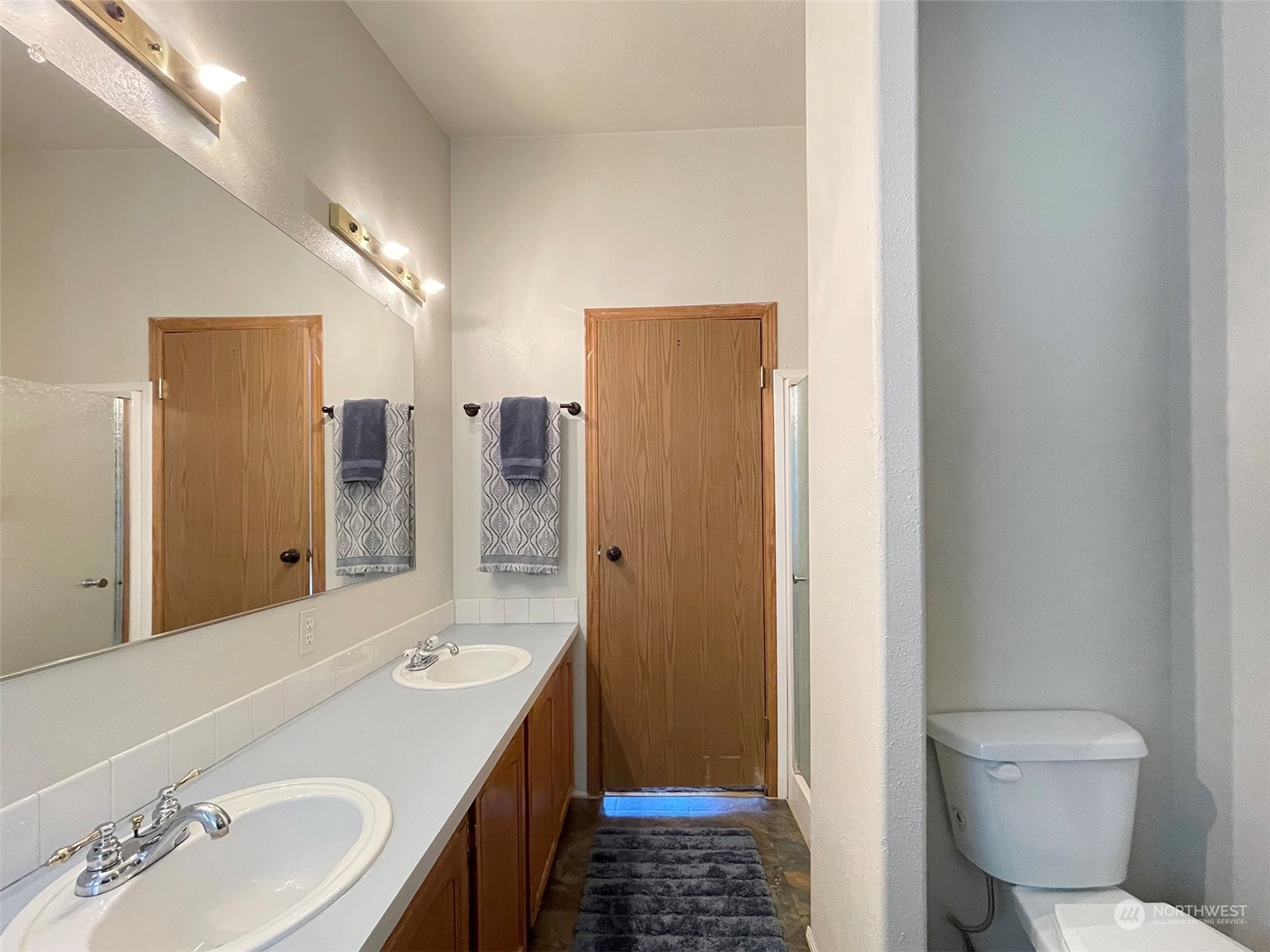 1010 Lemmon Road Port Angeles, WA 98362 - Photo 33 of 40 a bathroom with a sink a toilet and shower