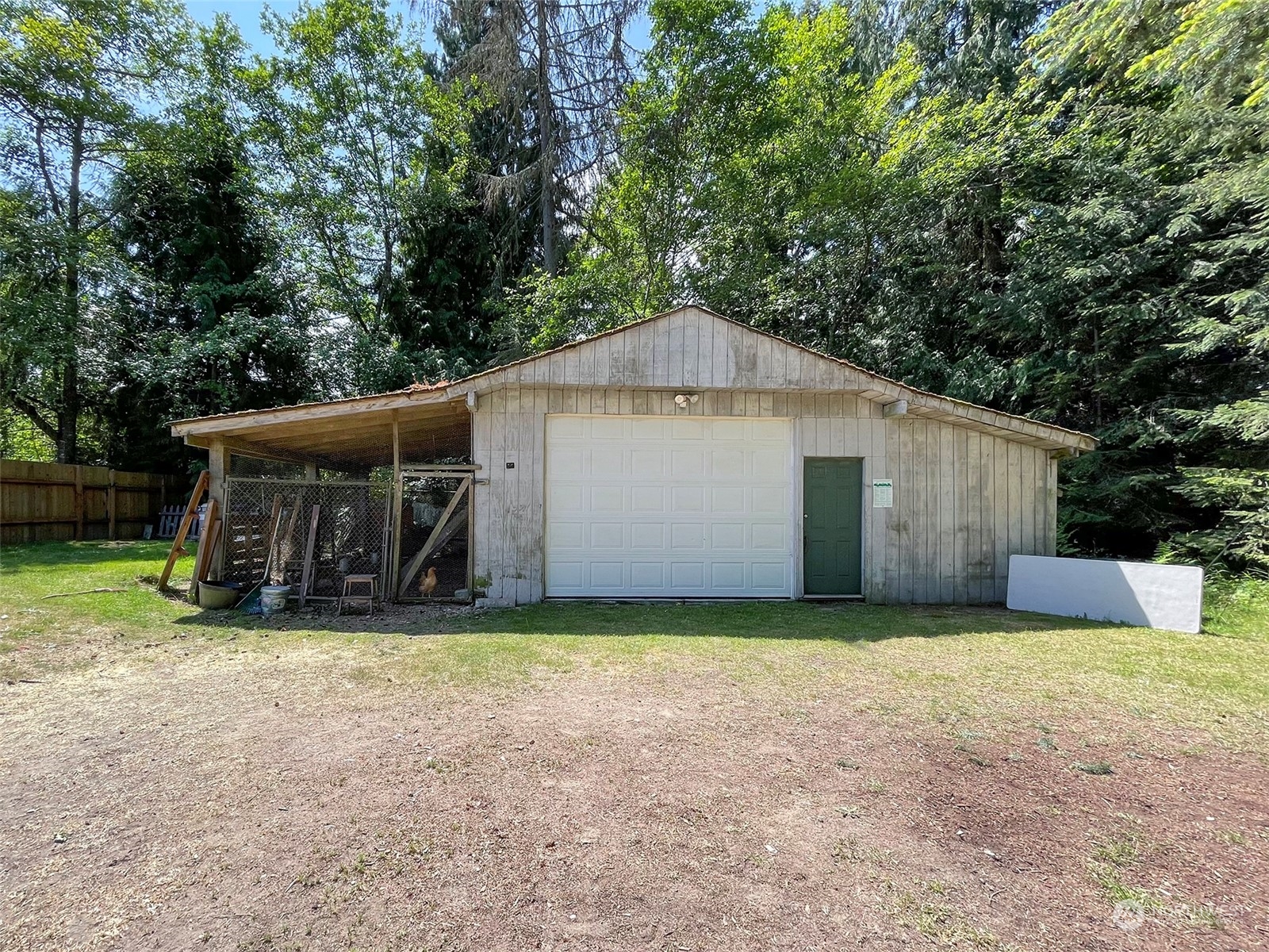 1010 Lemmon Road Port Angeles, WA 98362 - Photo 37 of 40 a view of a house with a yard and garage