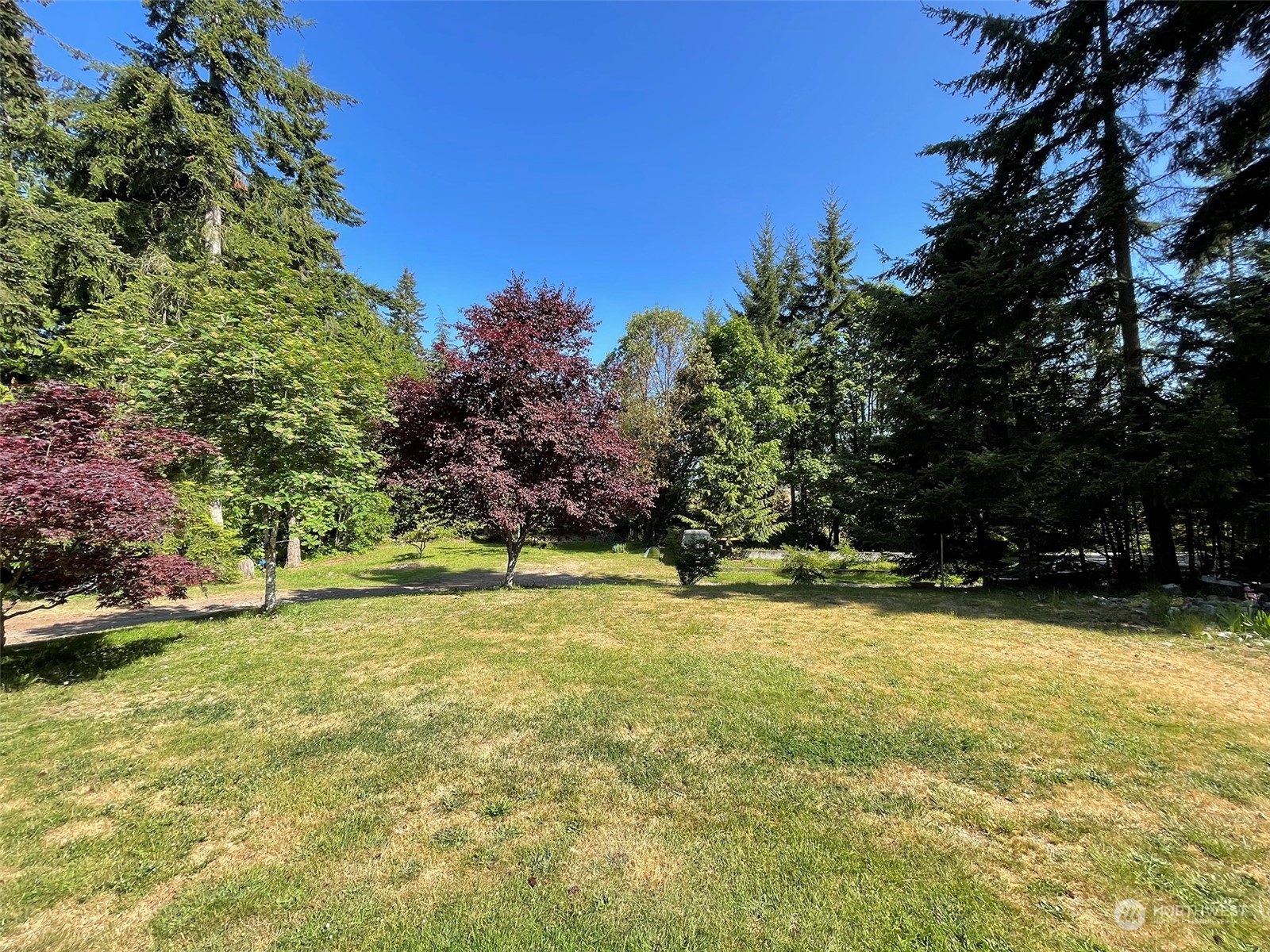 1010 Lemmon Road Port Angeles, WA 98362 - Photo 38 of 40 a view of a swimming pool with an outdoor space and seating area