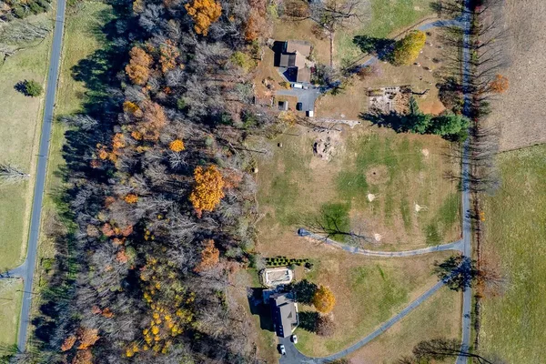 an aerial view of residential houses with outdoor space
