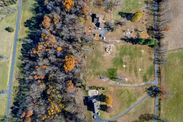 an aerial view of residential houses with outdoor space