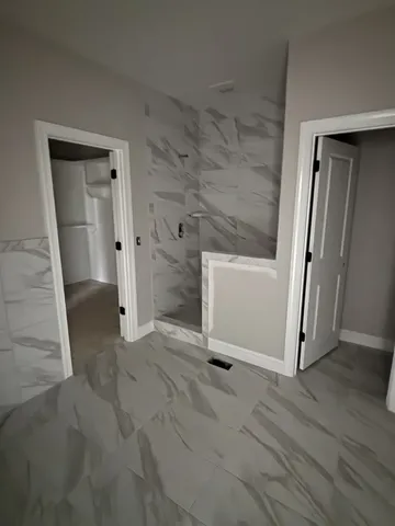 an empty room with a wooden door