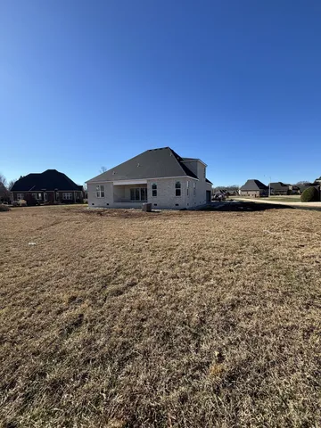 a view of a large body of water with a building in the background