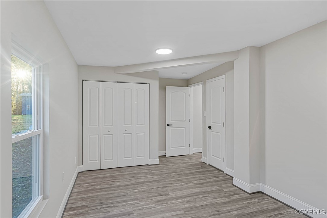 15412 Moores Mill Road Ruther Glen, VA 22546 - Photo 17 of 31 a view of empty room with wooden floor