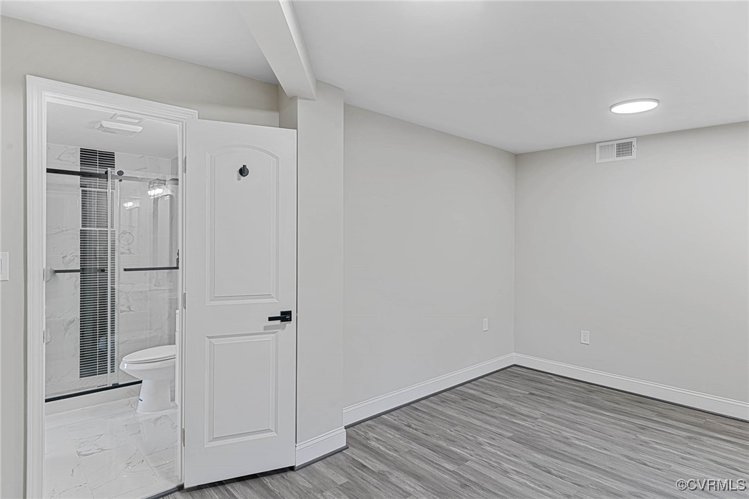 15412 Moores Mill Road Ruther Glen, VA 22546 - Photo 18 of 31 a view of empty room with wooden floor and closet