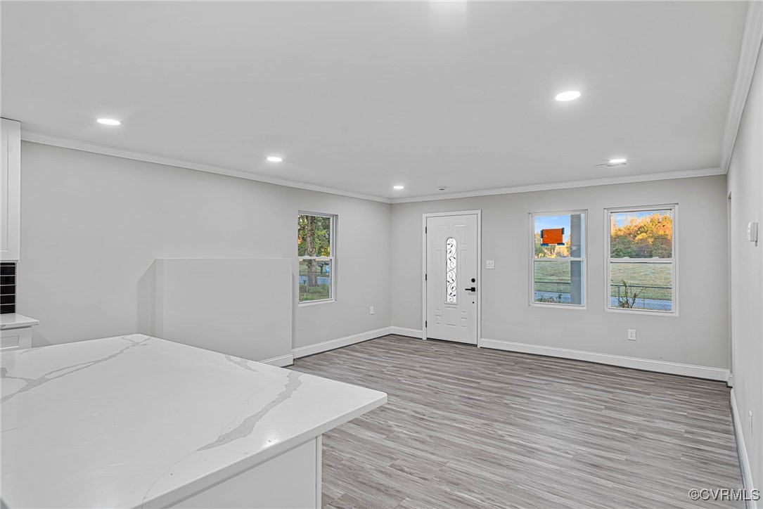 15412 Moores Mill Road Ruther Glen, VA 22546 - Photo 23 of 31 an empty room with wooden floor and window