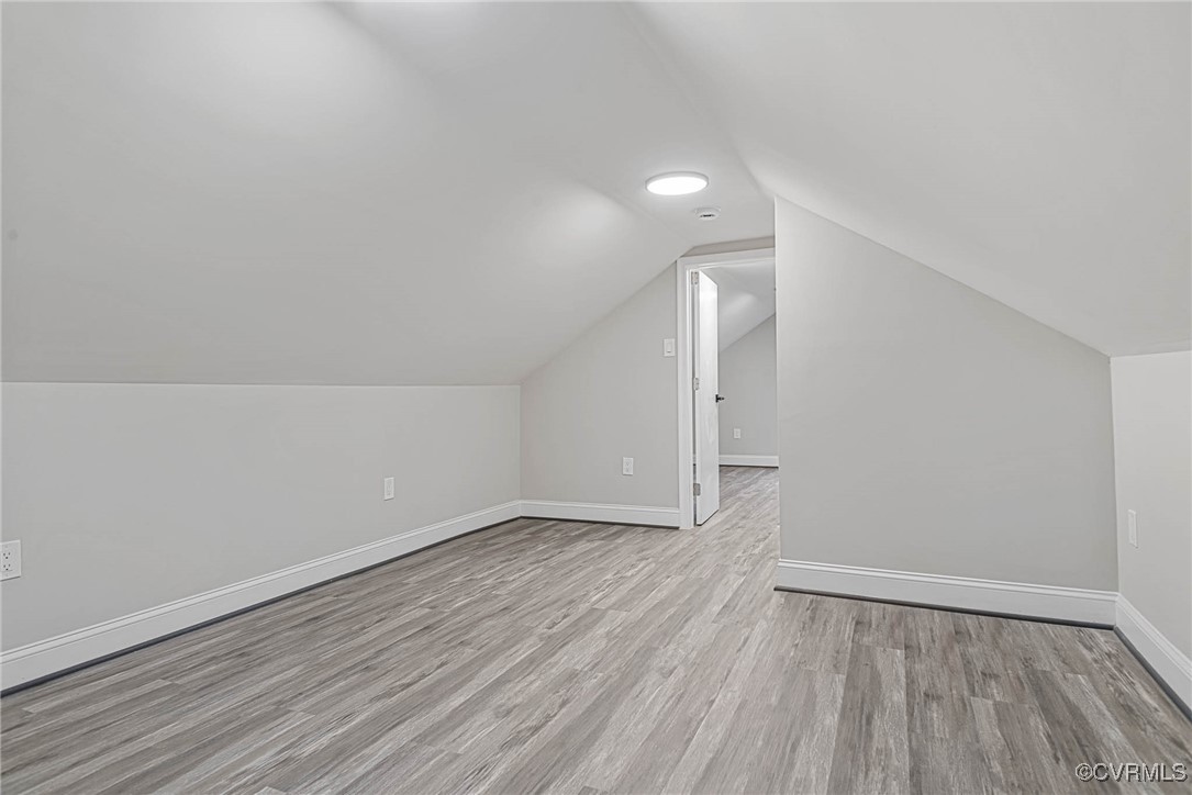 15412 Moores Mill Road Ruther Glen, VA 22546 - Photo 28 of 31 a view of an empty room with wooden floor and a window