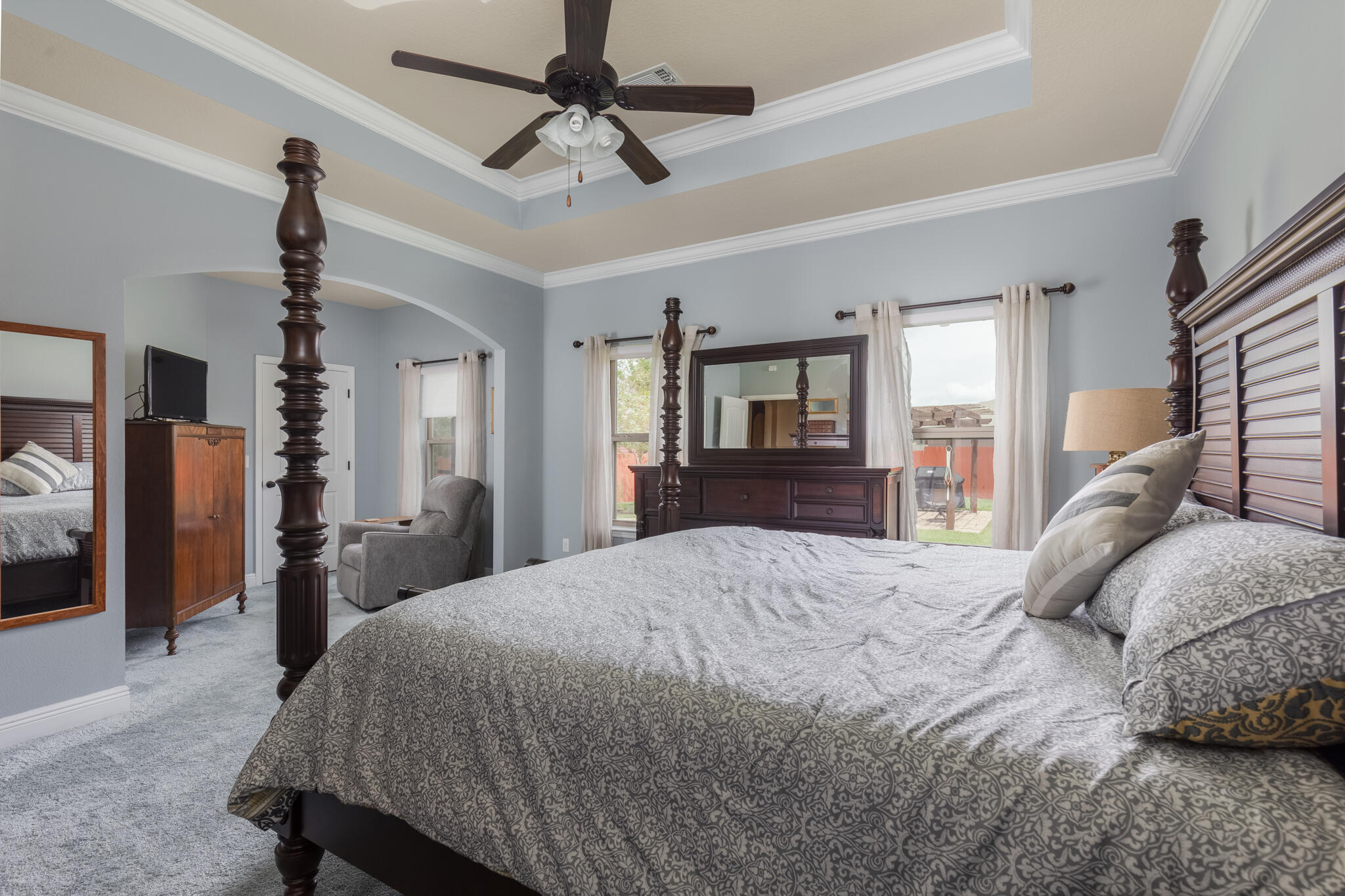 3379 Citrine Circle Crestview, FL 32539 - Photo 18 of 33 a bedroom with a bed ceiling fan and a wooden floor