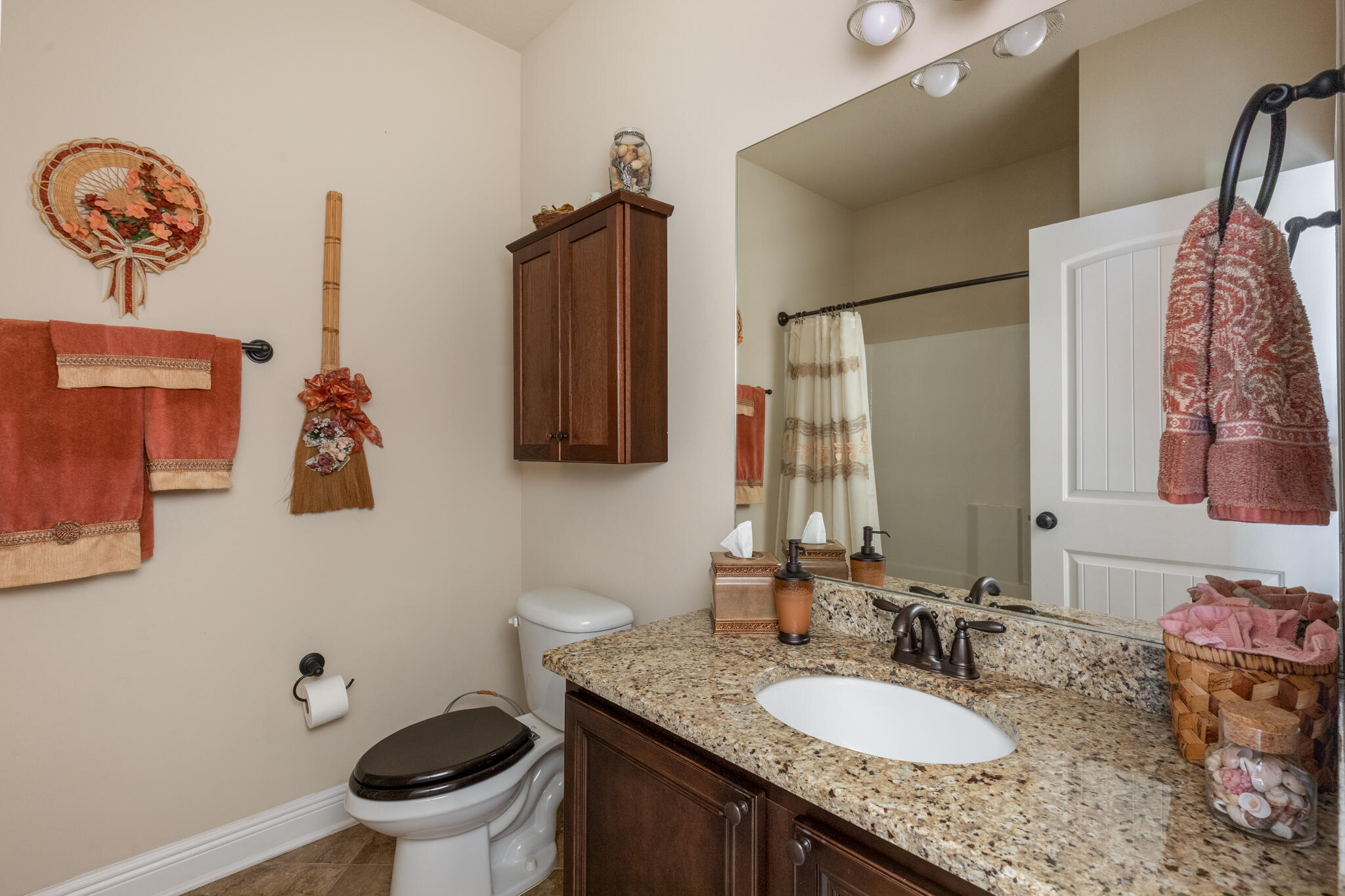 3379 Citrine Circle Crestview, FL 32539 - Photo 24 of 33 a bathroom with a granite countertop sink and a mirror