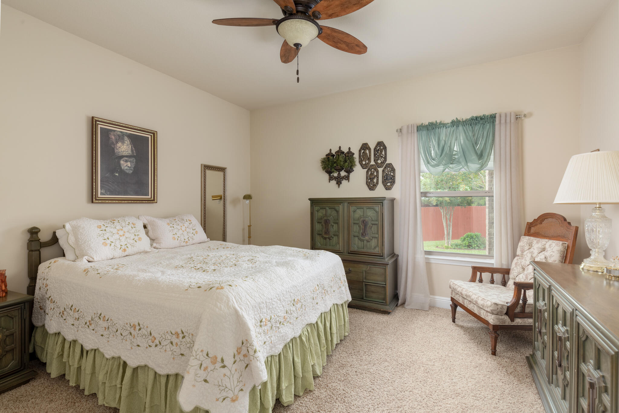 3379 Citrine Circle Crestview, FL 32539 - Photo 25 of 33 a spacious bedroom with a bed and a chandelier