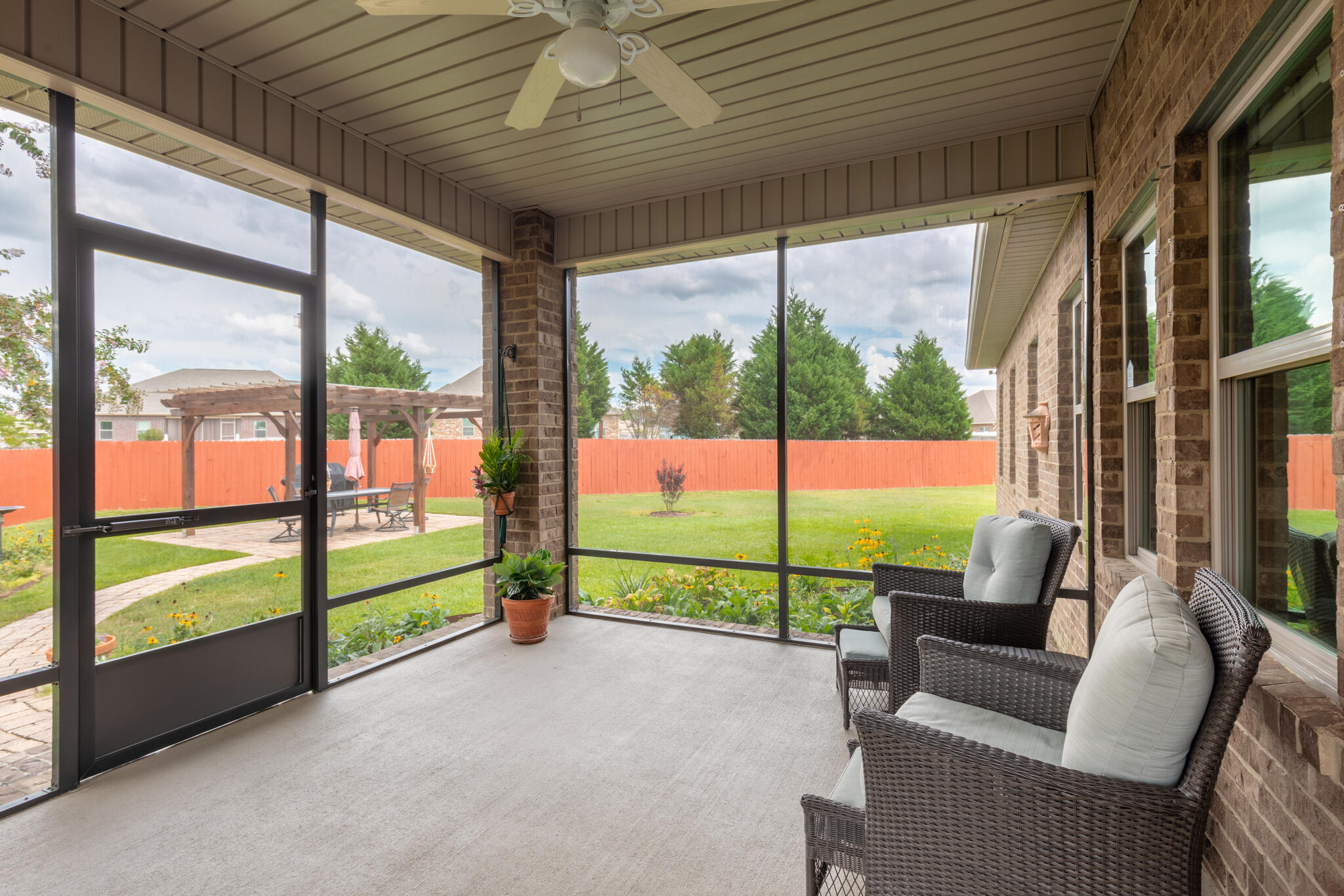 3379 Citrine Circle Crestview, FL 32539 - Photo 26 of 33 a view of a porch with furniture and a yard