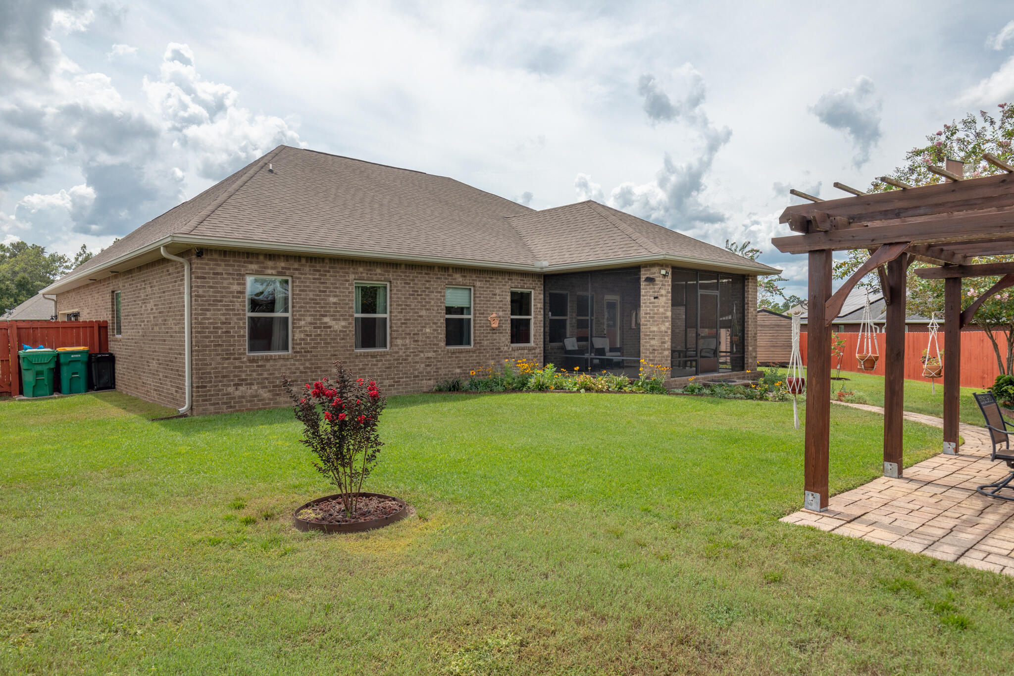 3379 Citrine Circle Crestview, FL 32539 - Photo 29 of 33 a front view of a house with garden