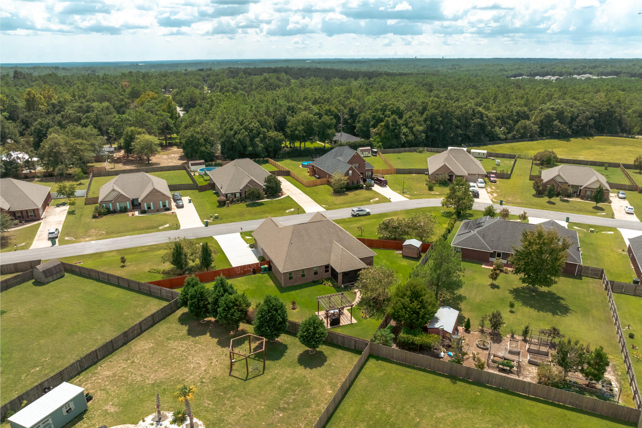 3379 Citrine Circle Crestview, FL 32539 - Photo 9 of 33 an aerial view of a house with swimming pool and ocean view