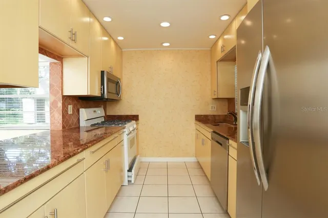 a kitchen with a stove and a microwave