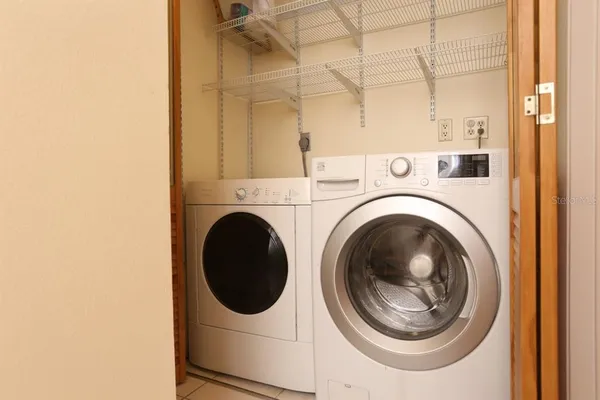a view of a porch with chairs and backyard
