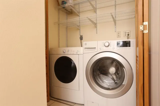 a view of a porch with chairs and backyard