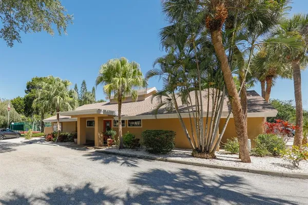 a view of a park with iron fence