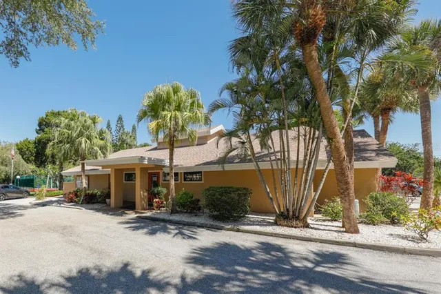 a view of a park with iron fence