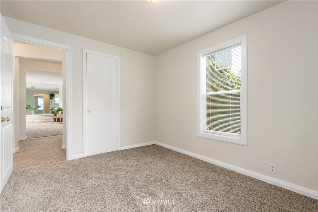 10651 Rustic Road South Seattle, WA 98178 - Photo 11 of 34 an empty room with windows and entrance