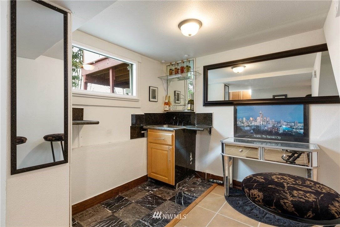 10651 Rustic Road South Seattle, WA 98178 - Photo 18 of 34 a kitchen with stainless steel appliances a stove and a microwave