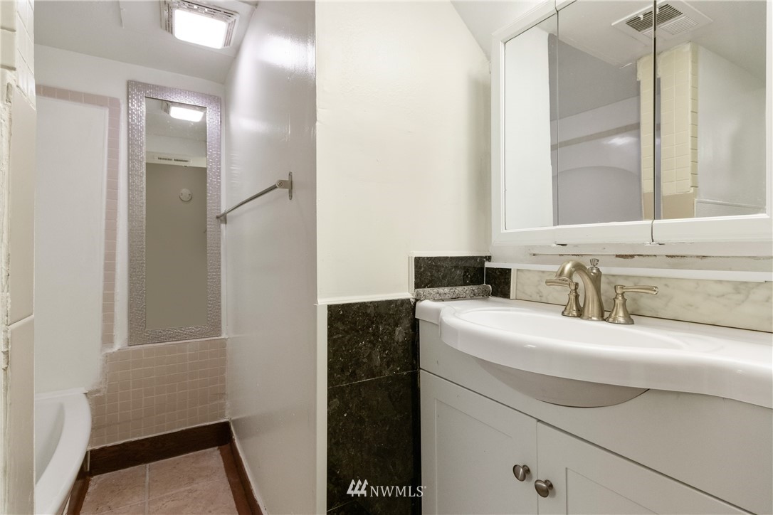 10651 Rustic Road South Seattle, WA 98178 - Photo 20 of 34 a bathroom with a sink and a mirror
