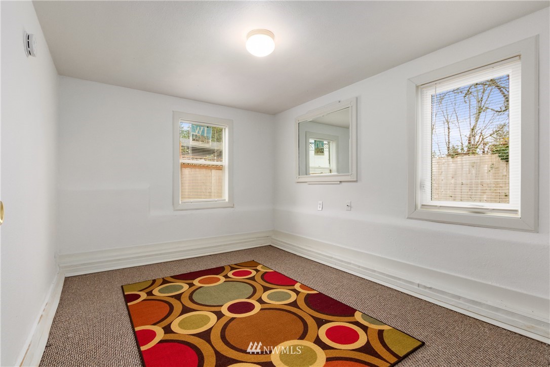 10651 Rustic Road South Seattle, WA 98178 - Photo 27 of 34 a view of an empty room with window and furniture