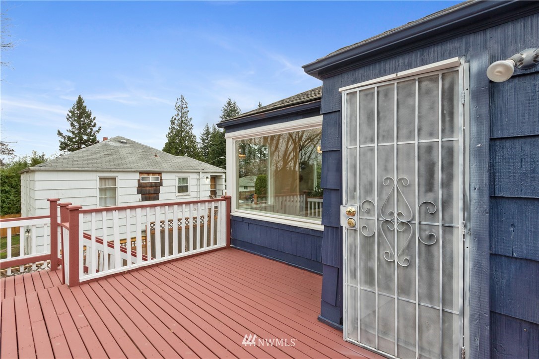 10651 Rustic Road South Seattle, WA 98178 - Photo 29 of 34 a view of a house with wooden deck