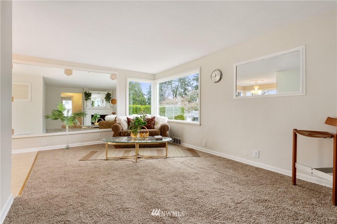10651 Rustic Road South Seattle, WA 98178 - Photo 3 of 34 a living room with furniture and a large window