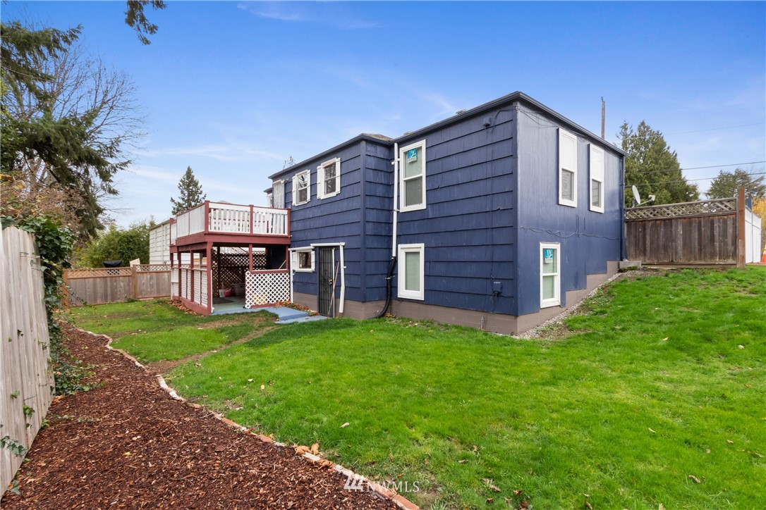 10651 Rustic Road South Seattle, WA 98178 - Photo 33 of 34 a view of a house with a yard